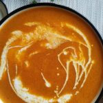 tomato bisque in a white bowl