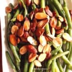 green beans almondine served on a white plate