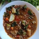 vegetable lentil soup in a white soup bowl